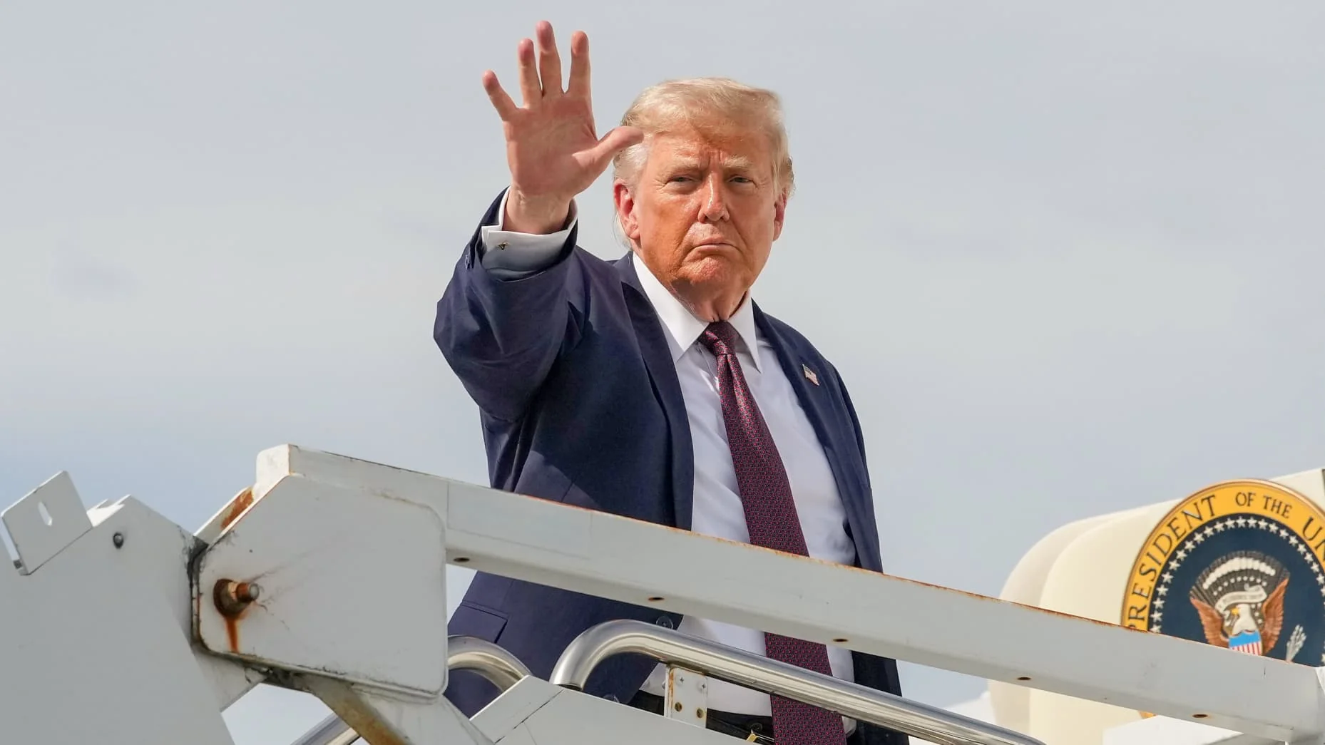 U.S. President Donald Trump waves as he boards Air Force One to depart Reading Regional Airport on June 23, 2026.
